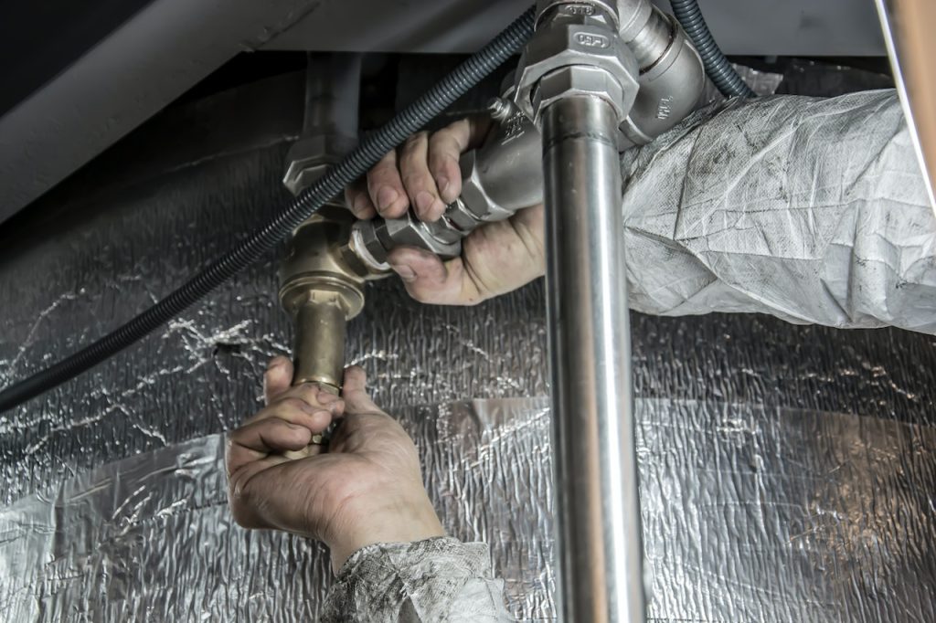 plumber fixing pipes, our work