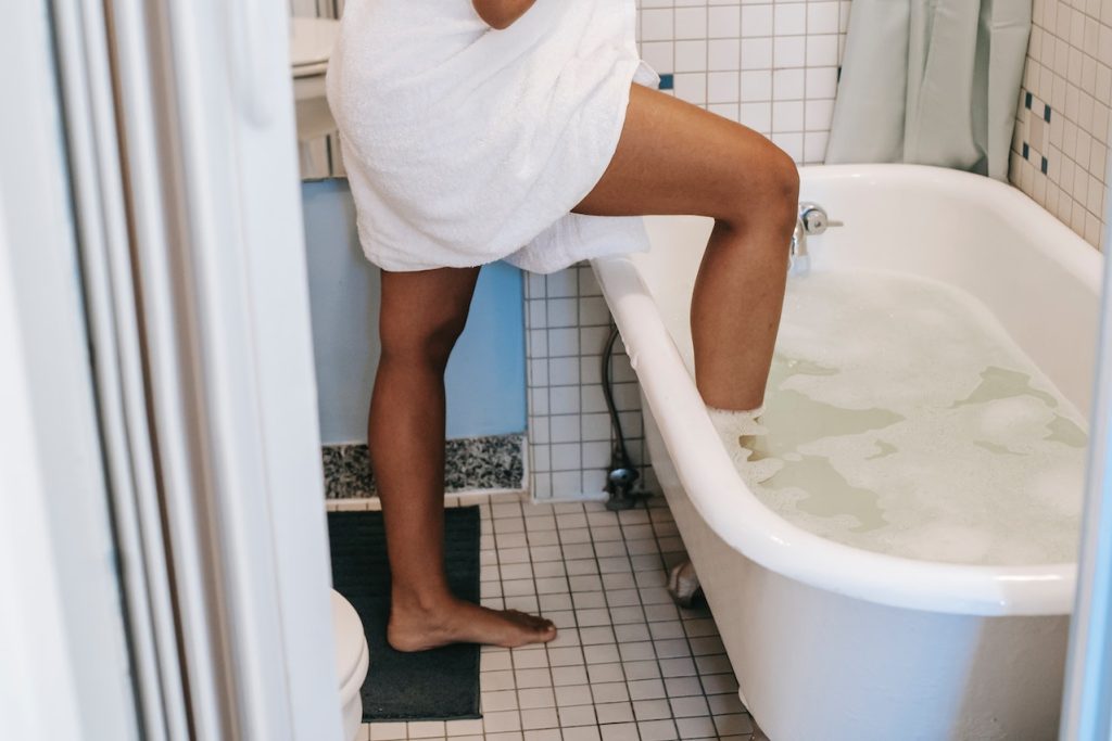 taking a bath in the tub